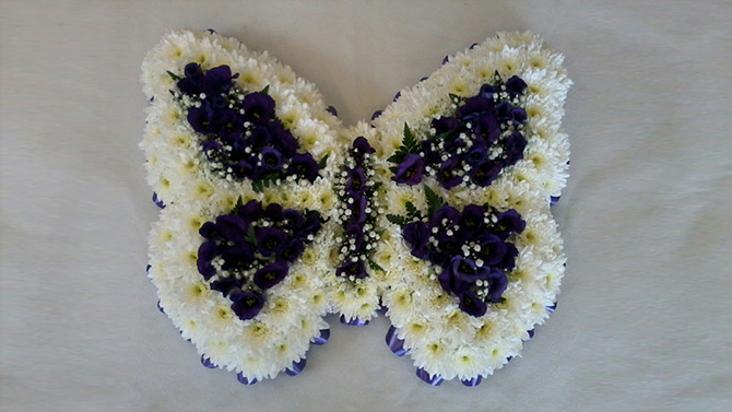 Butterfly shaped funeral flowers white and blue florist north Bristol FBF1