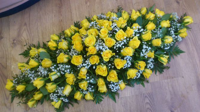 Funeral coffin top casket spray yellow flowers green Bristol FCT1