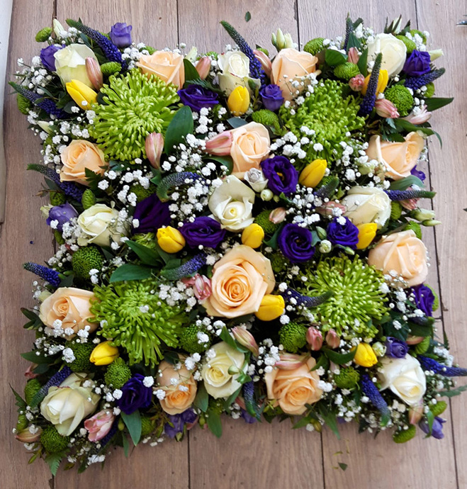 Cushion shaped funeral flowers Bristol florist FCU5