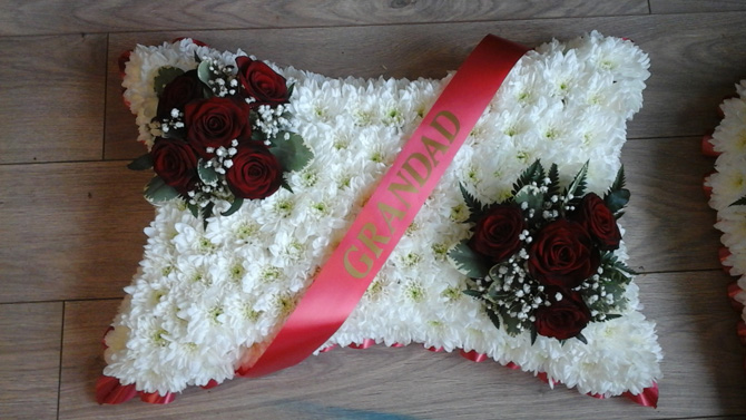 Pillow shaped funeral flowers grandad sash white red Bristol florist FPI2