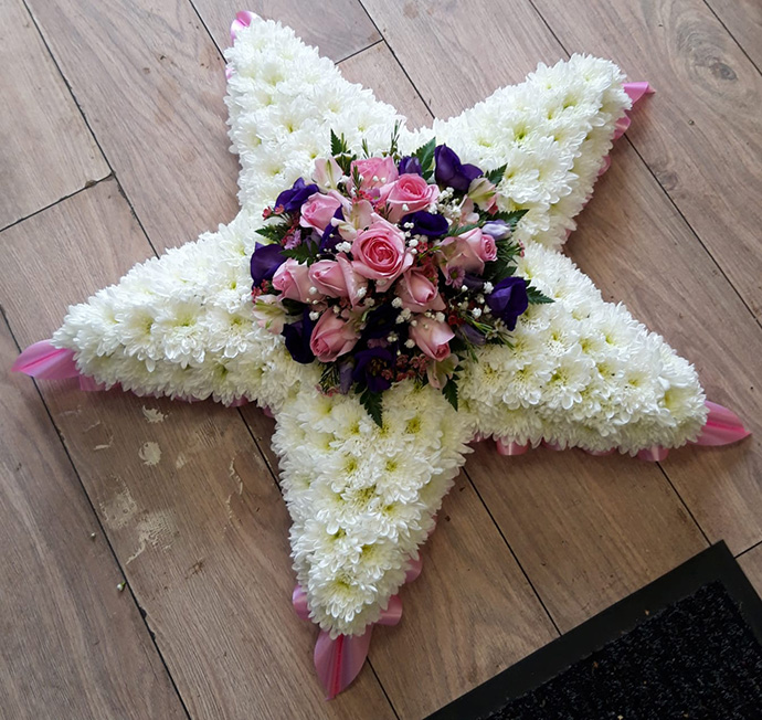 Star shape funeral flowers Bristol florist FST6