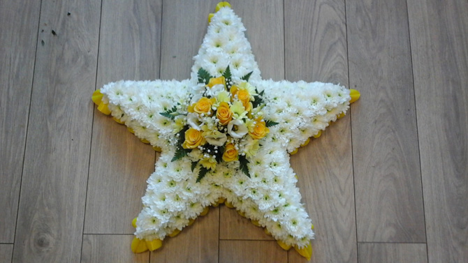 Star shaped funeral flowers white yellow florist north Bristol FST3