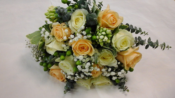 Bride hand tied bouquets peach roses cream roses Wedding flowers Bristol WB4